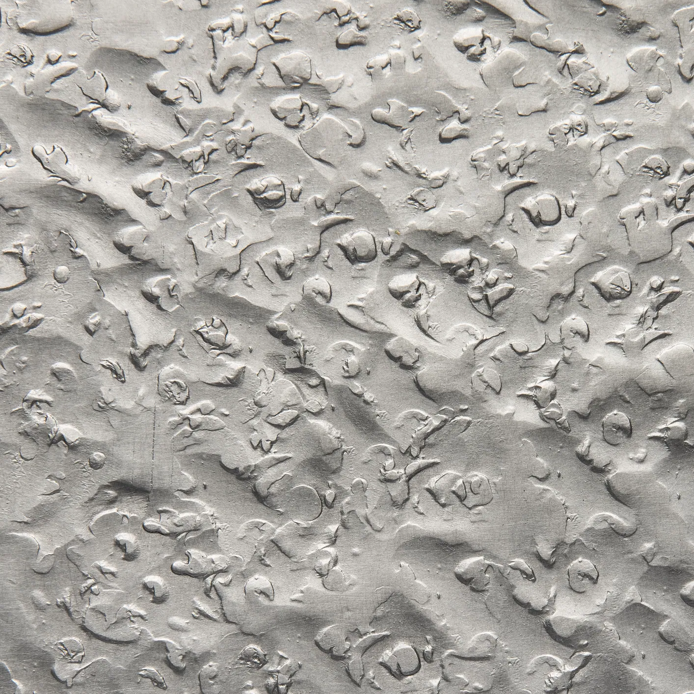 Detail of a finished metal surface with a natural patina